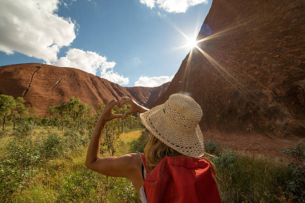 istock Woman hiking frames landscape into heart shape 614045420