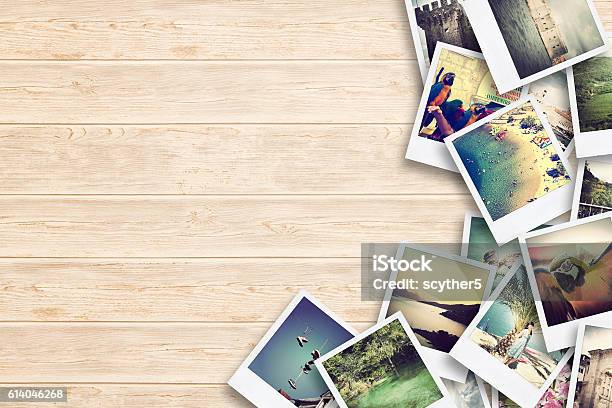 Frame With Old Paper And Photos On Wooden Background Stock Photo - Download Image Now