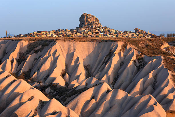 Uchisar Castle in Cappadocia. Uchisar castle and dunes at the sunrise in Cappadocia. kasha katuwe tent rocks stock pictures, royalty-free photos & images