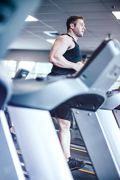 istock Man Running on Gym Treadmill 614048402