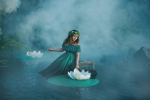 istock Witch casts a spell on the water in the fog 614049318