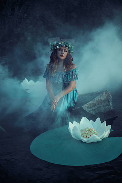 istock Witch casts a spell on the water in the fog 614049796