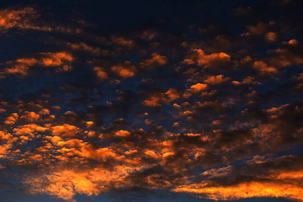 istock Golden clouds on the horizon.Golden sunlight through clouds .Ama 614049864