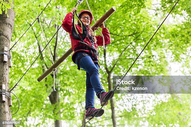 Child Reaching Platform Climbing In High Rope Course Stock Photo - Download Image Now