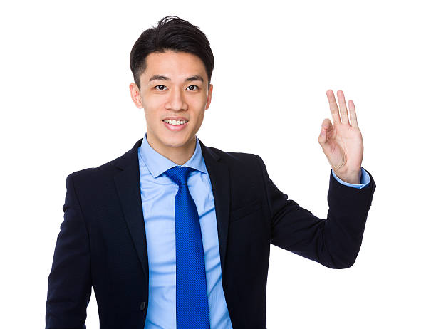 istock Asian young business man making gestures 614050748