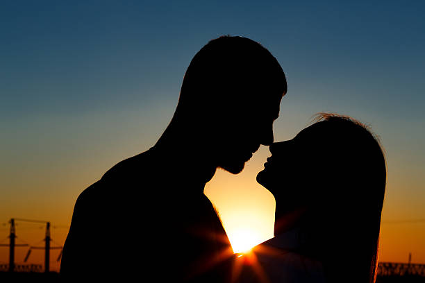 istock Silhouettes of men and women 614053228