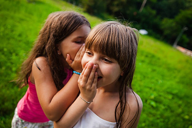 istock Two happy girls outside 614054678