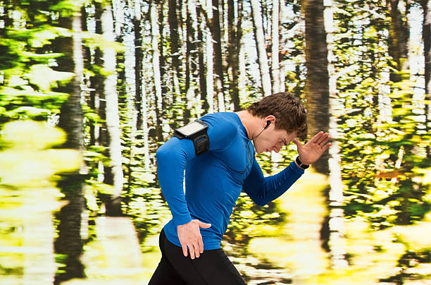 istock Male runner running outdoors 614055822