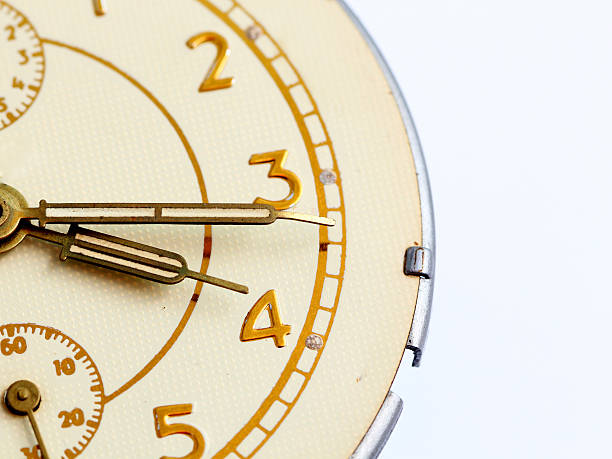 istock Closeup of hands on clock face 614056276