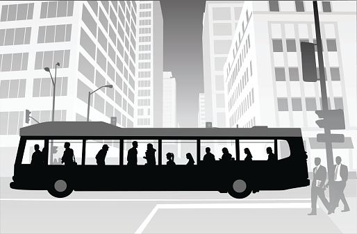 A vector silhouette illustration of a city bus with passengers traveling through an intersection, and tall office buildings.