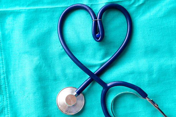 istock Medical stethoscope rests on a uniform close-up 614058374