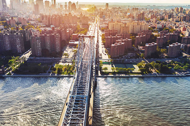 Williamsburg Bridge over the East River in Manhattan, NY Aerial view of the the Williamsburg Bridge over the East River in Manhattan, New York City williamsburg bridge stock pictures, royalty-free photos & images