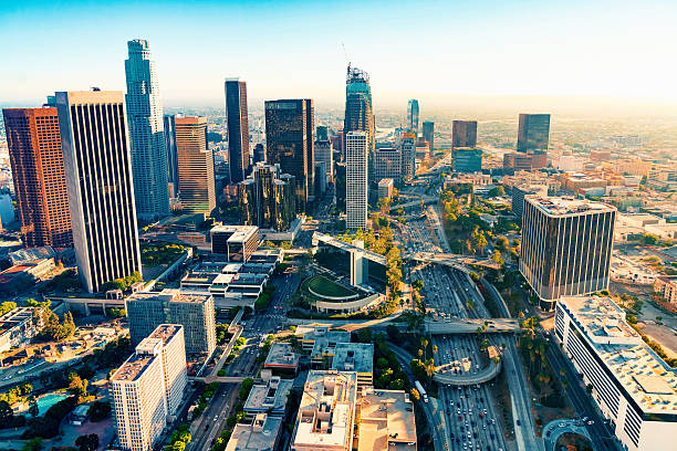 Aerial view of a Downtown LA at sunset Aerial view of a Downtown Los Angeles at sunset los angeles aerial stock pictures, royalty-free photos & images