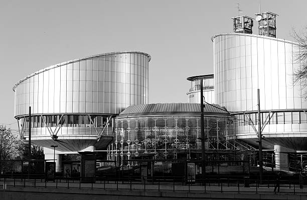 European Court of Human Rights Justice Strasbourg Strasbourg, France - January 28, 2014: European Court of Human Rights in Strasbourg with empty tramway station european court of human rights stock pictures, royalty-free photos & images