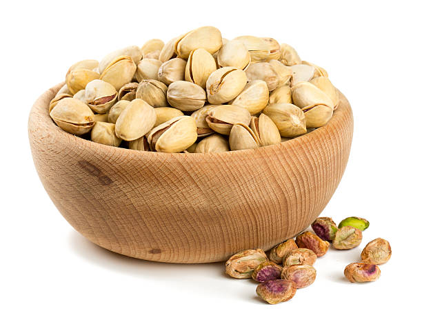istock bowl of pistachio isolated on white 614109866