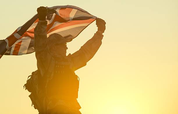 istock British Soldier with UK Flag 614117858
