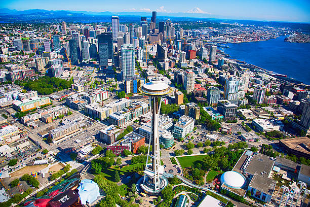 Seattle Washington - May 17th, 2014: Its the Space Needle and Museum of Pop Culture previously called EMP Museum was designed by Frank Gehry in the campus of Seattle Center.
