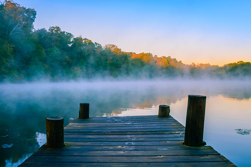 Morning mist on reflective water, Mt Saint Francis, Indiana.