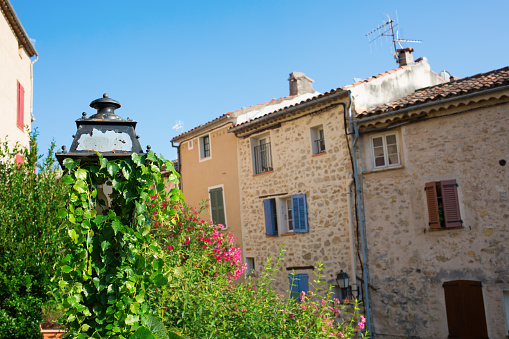 old street lamp in front of old buildings in Seillans France