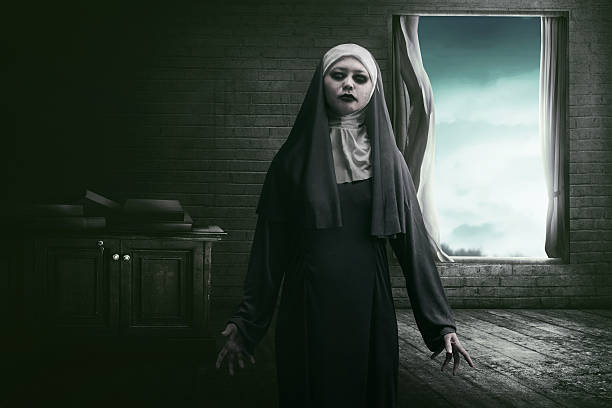 istock Horrible asian woman nun scare 614122654