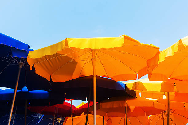 istock colorful yellow and blue sunshades at a beach restaurant 614122736