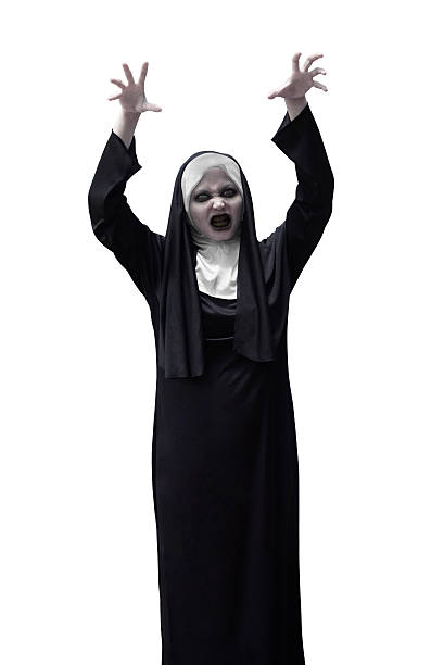 istock Scary asian nun raise up hand want to scare 614123732