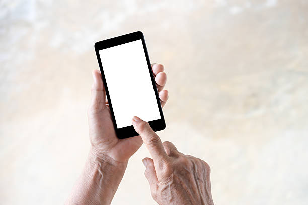 istock older person, hand holding and touch smartphone with blank 614124844