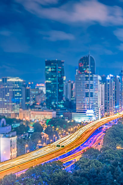 istock Busy highway traffic light trails at night 614125940
