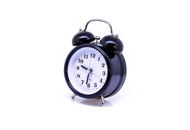 istock Black alarm clock isolated on white background. 614126774
