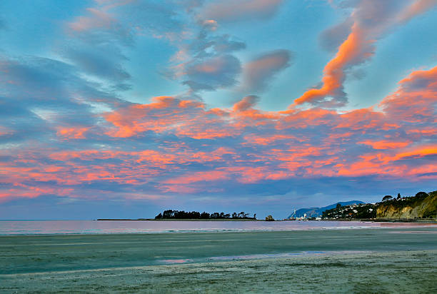 istock Colorful sunset sky with overcast clouds  at Wharariki Beach, Nelson 614127052