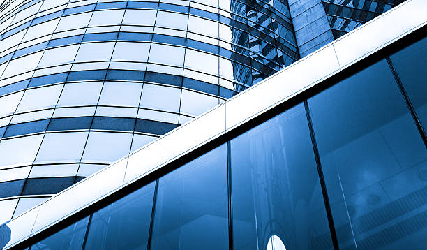 istock windows of business building with blue color 614128744
