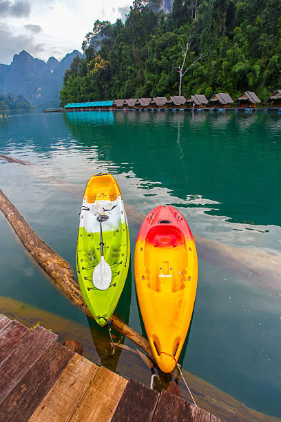 istock Canoe in a beautiful mountains lake forest 614129526