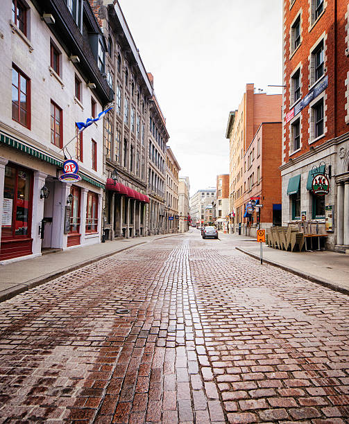 istock Old Montreal cobblestone  paved street Quebec Canada 614130592