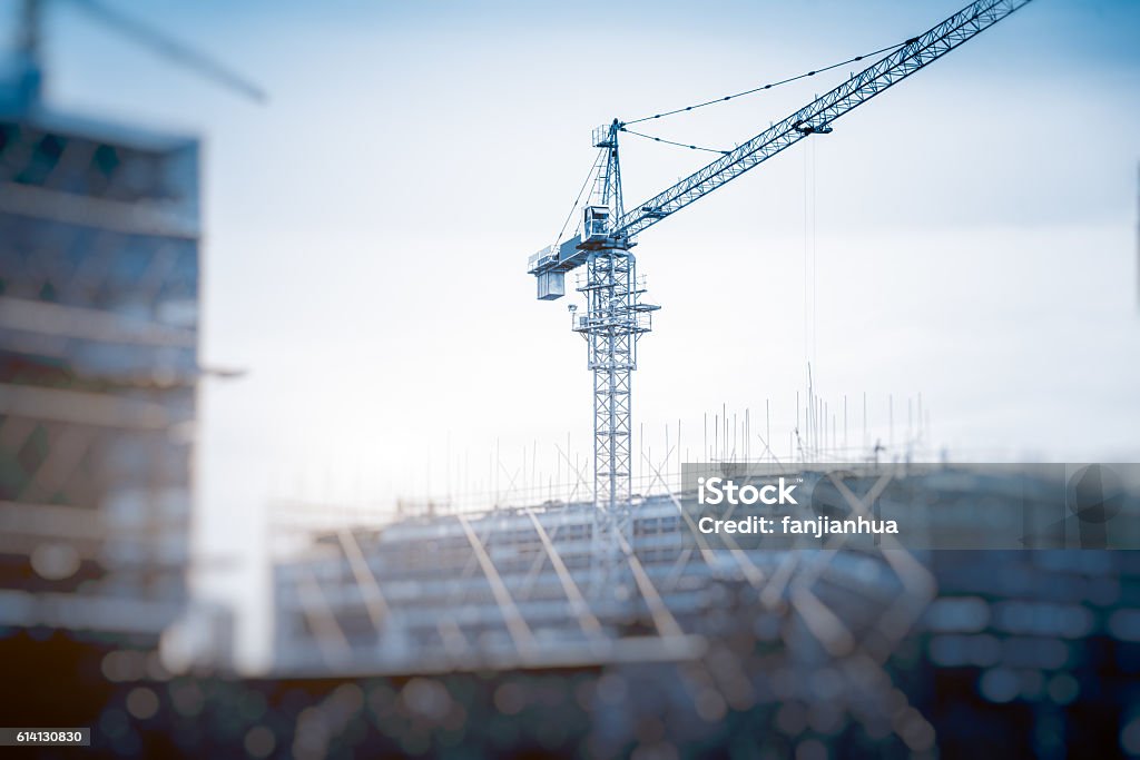 Low Angle View Of Cranes against skyline Low Angle View Of Cranes against skyline in Shanghai,China. Construction Site Stock Photo