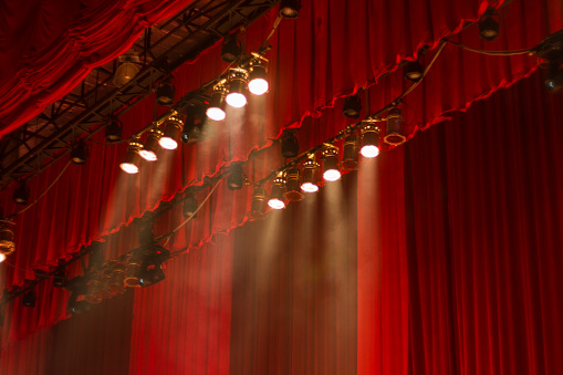 Red curtains and lights on stage at the show.