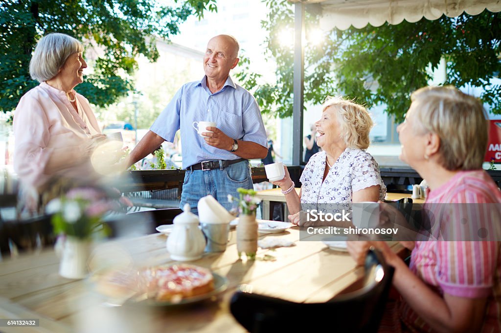 Get-together of seniors Happy senior friends having tea in cafe Senior Adult Stock Photo