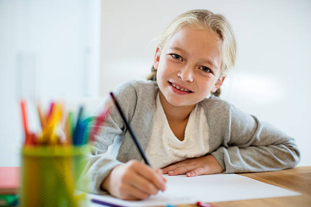 istock Pretty girl doing her homework 614133928