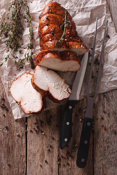 istock rustic food: roasted turkey breast  on the table. vertical 614135258