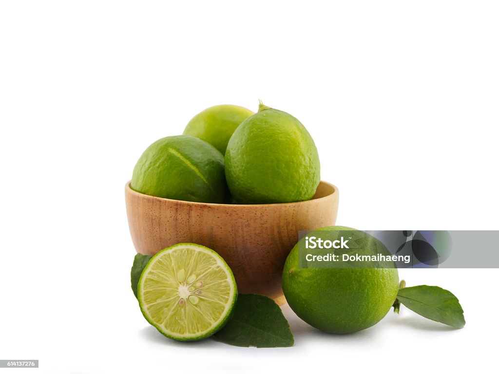 Fresh lime group in bowl on white background Fresh lime group in bowl isolated on white background Lime Stock Photo