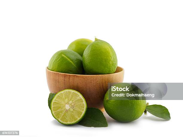 Fresh Lime Group In Bowl On White Background Stock Photo - Download Image Now - Lime, Bowl, Branch - Plant Part
