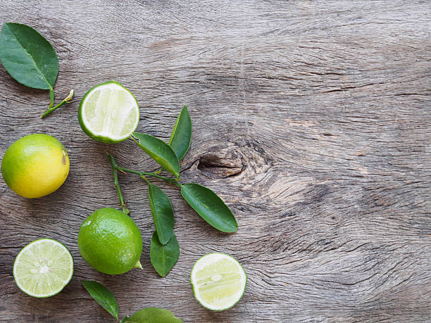 istock Top view of green lemon fruit and slice 614137434