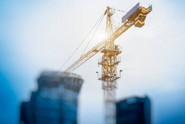 istock Low Angle View Of Cranes against skyline 614139218