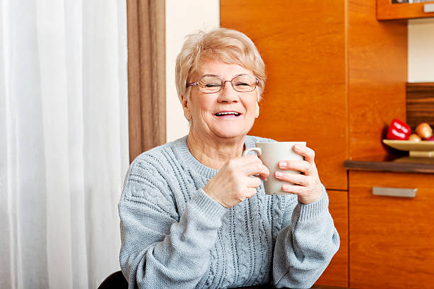 istock Senior woman drinking coffee or tea 614141472