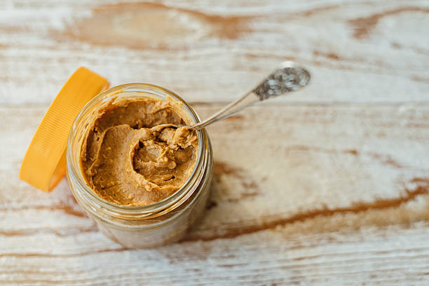 istock Heart drawn on peanut butter in glass jar 614142634