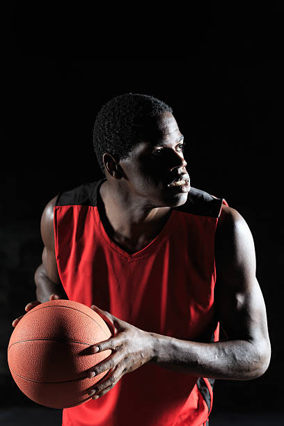 istock Basketball player dribbling, looking away 614143034