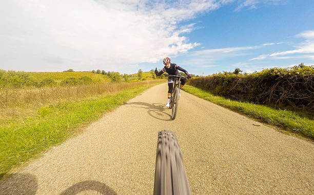 istock Happy Man on mountain bike in a forest 614143584