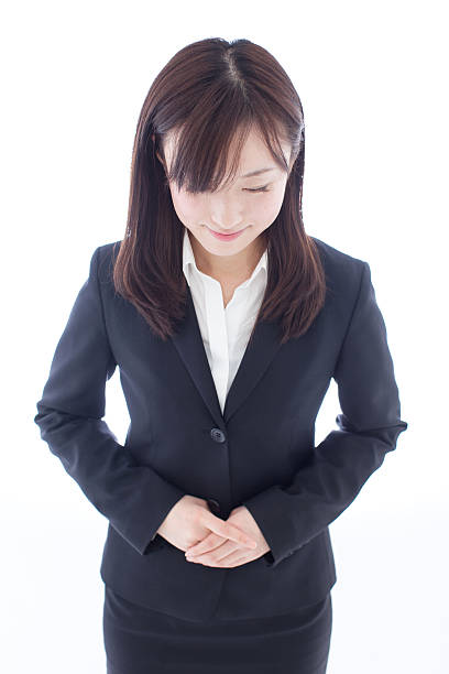 Businesswoman bowing Businesswoman bowing bowing stock pictures, royalty-free photos & images