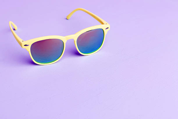 istock colorful sunglasses on purple background 614144936