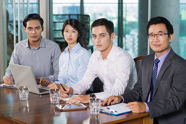 istock Four Business People Holding Meeting in Office 614145596
