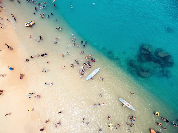 istock Aerial view of people at the beach 614145802
